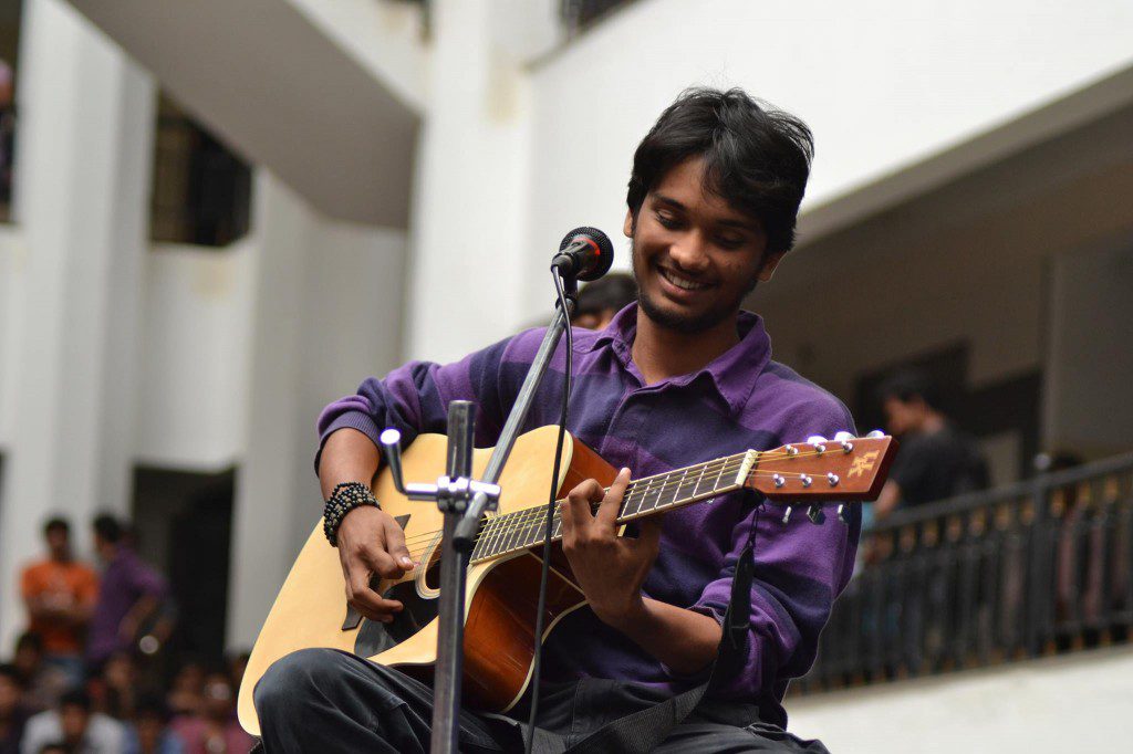 Mahesh Raghunandan playing the guitar